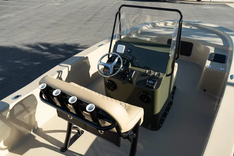 Slide: The Image of 2025 Savannah SS21 Duck boat interior with steering console and rod holders. - 10