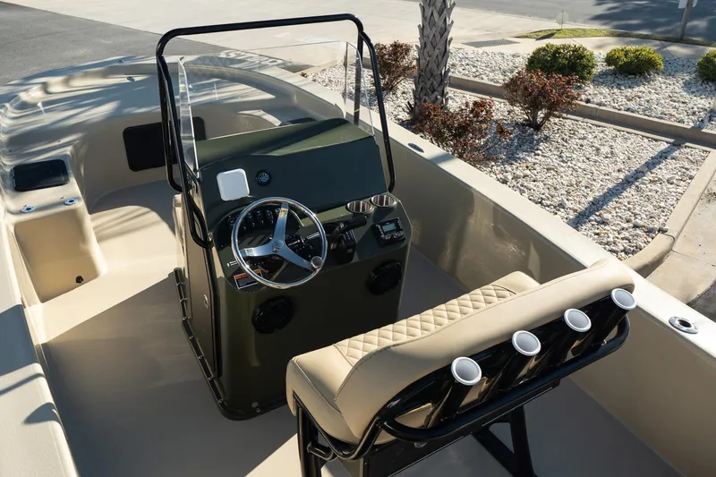 Slide: The Image of 2025 Savannah SS21 Duck boat interior with steering console and cushioned seating. - 12