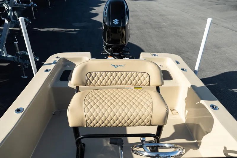 Slide: The Image of Savannah SS21 Duck 2025 boat interior with quilted seats and outboard motor. - 14