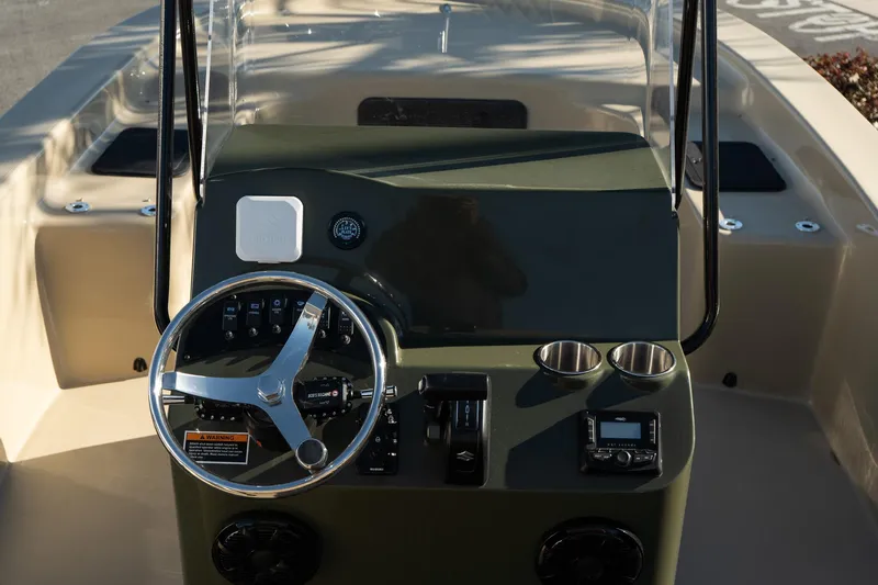 Slide: The Image of 2025 Savannah SS21 Duck boat dashboard with steering wheel and controls. - 18