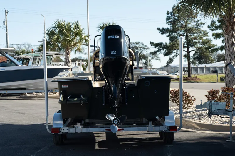 Slide: The Image of 2025 Savannah SS21 Duck boat on trailer, rear view, parked outdoors. - 9
