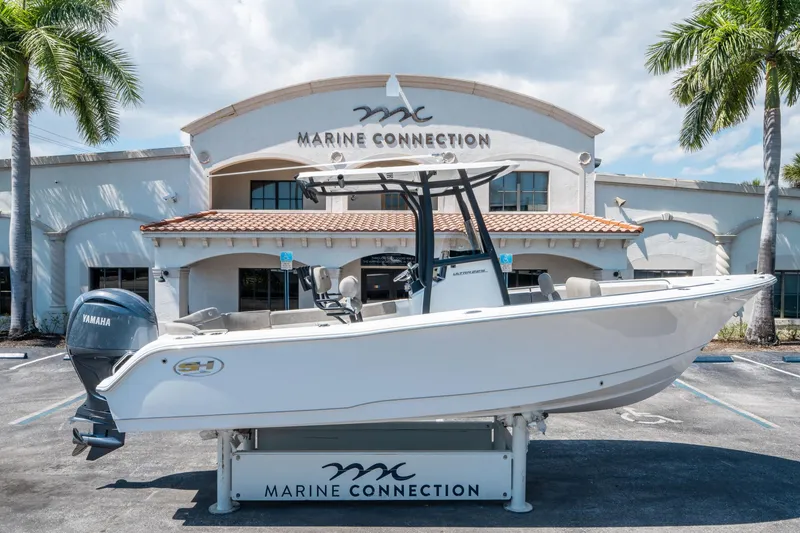 Slide: The Image of 2025 Sea Hunt Ultra 229 boat displayed at Marine Connection dealership. - 1