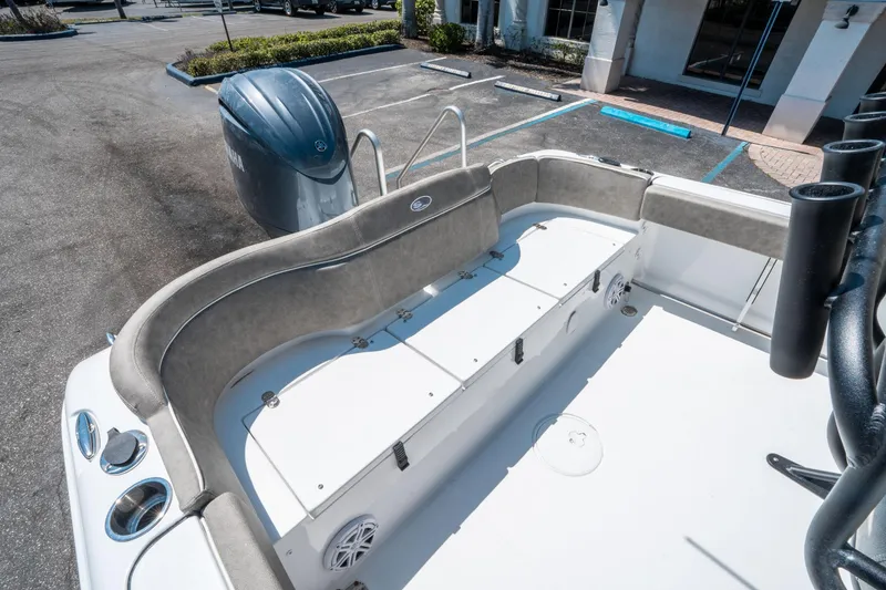 Slide: The Image of 2025 Sea Hunt Ultra 229 boat interior with seating and Yamaha outboard motor. - 12