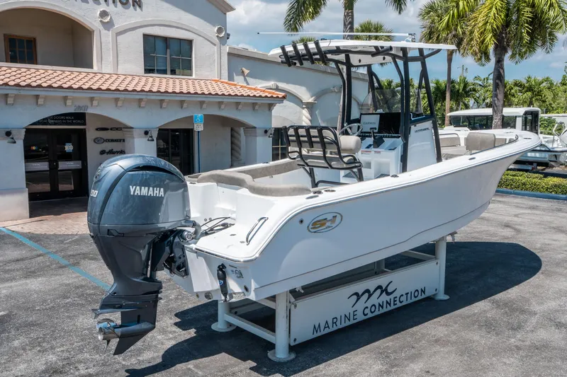 Slide: The Image of 2025 Sea Hunt Ultra 229 boat with Yamaha engine at Marine Connection dealership. - 2