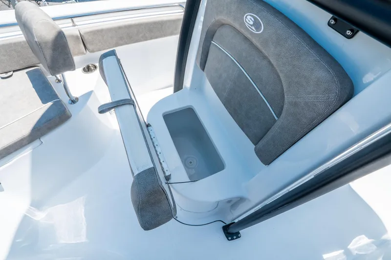 Slide: The Image of 2025 Sea Hunt Ultra 229 boat interior with seating and storage compartment. - 23