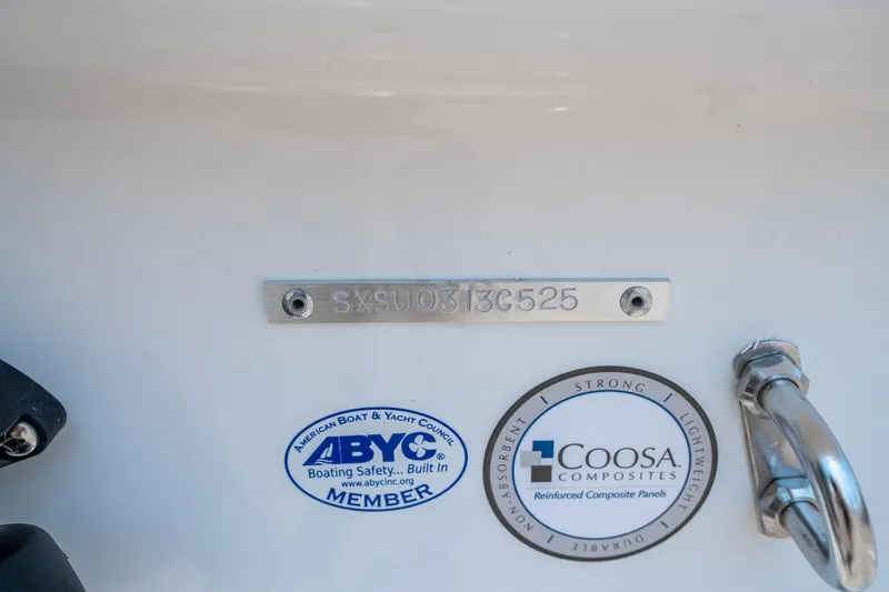 Slide: The Image of 2025 Sea Hunt Ultra 229 boat identification plate with ABYC and Coosa Composites labels. - 26