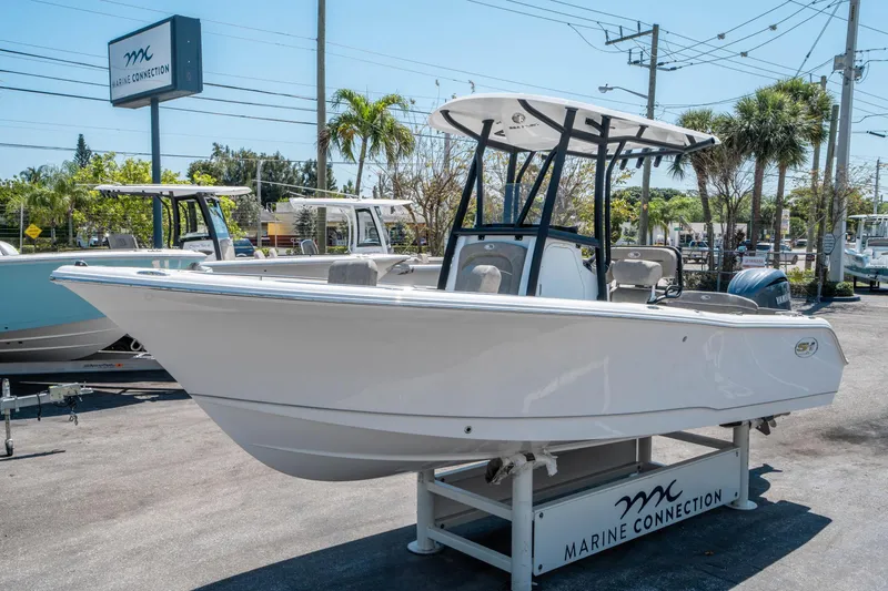 Slide: The Image of 2025 Sea Hunt Ultra 229 boat displayed at Marine Connection dealership. - 6