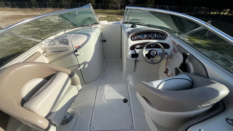 Slide: The Image of 2002 Sea Ray 270 Sundeck boat on trailer, parked outdoors. - 5