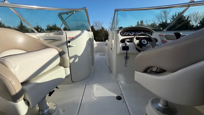 Slide: The Image of 2002 Sea Ray 270 Sundeck boat interior with steering wheel and dashboard. - 8