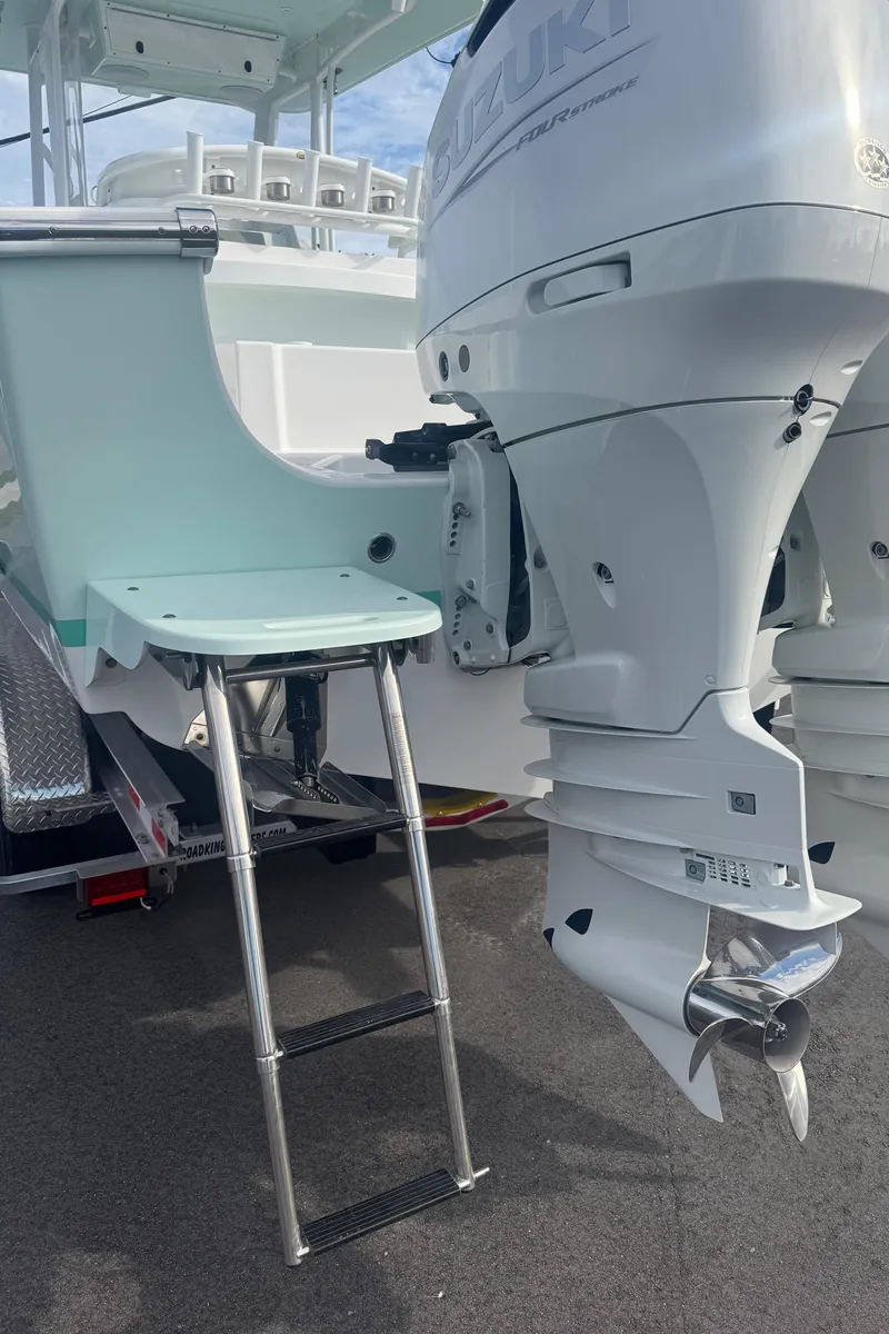 Slide: The Image of 2023 Albury Brothers 27 boat with dual outboard engines and a swim ladder. - 13