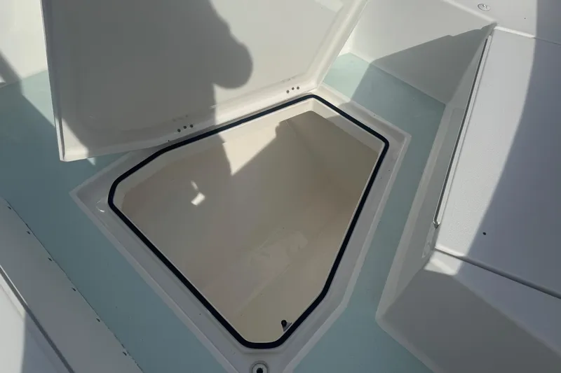 Slide: The Image of 2023 Albury Brothers 27 boat storage compartment with open hatch. - 14