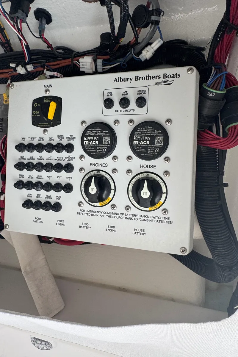 Slide: The Image of Control panel of a 2023 Albury Brothers 27 boat with wiring and switches. - 18