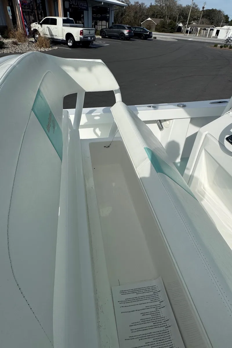 Slide: The Image of 2023 Albury Brothers 27 boat interior with seating and dashboard view. - 20