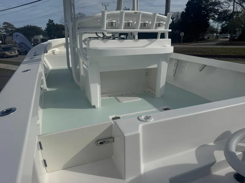 Slide: The Image of 2023 Albury Brothers 27 boat interior, showcasing spacious deck and seating area. - 4