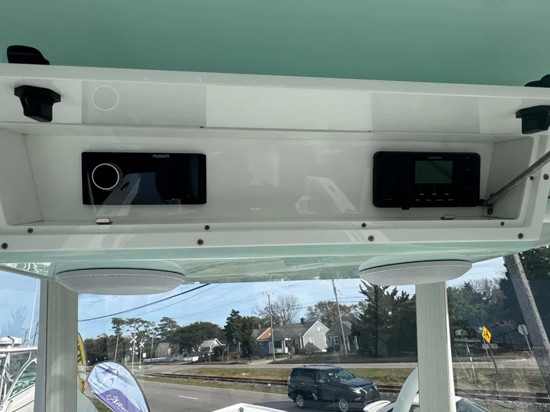 Slide: The Image of 2023 Albury Brothers 27 boat dashboard with electronic controls and speakers. - 8