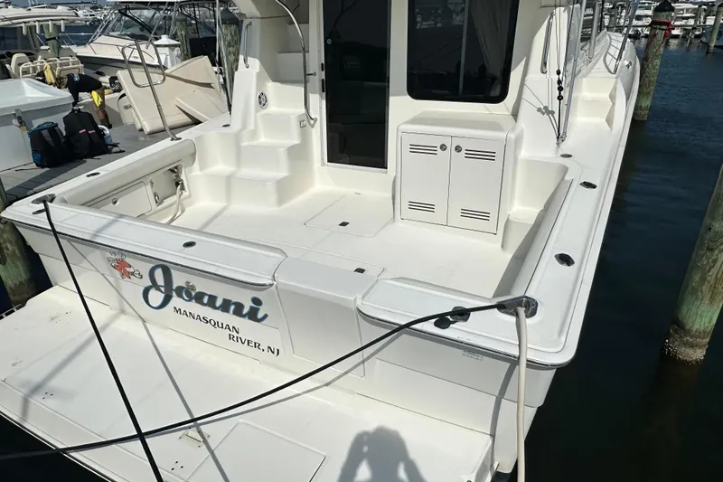 Slide: The Image of 2006 Silverton 42 Convertible yacht docked at Manasquan River, NJ. - 14