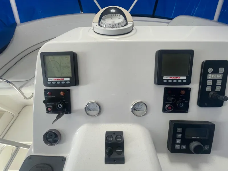 Slide: The Image of Control panel of a 2006 Silverton 42 Convertible yacht with navigation instruments. - 18
