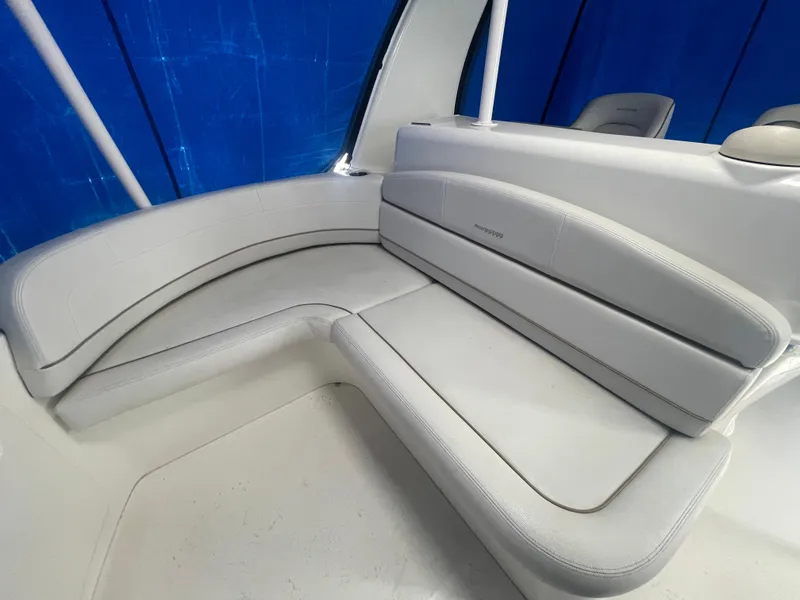 Slide: The Image of 2006 Silverton 42 Convertible boat interior with white cushioned seating. - 21