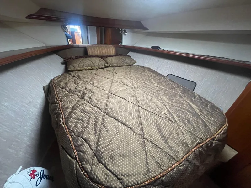 Slide: The Image of 2006 Silverton 42 Convertible cabin with cozy bed and elegant interior design. - 39