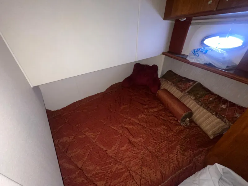 Slide: The Image of Cozy cabin interior of 2006 Silverton 42 Convertible yacht with plush bedding. - 41