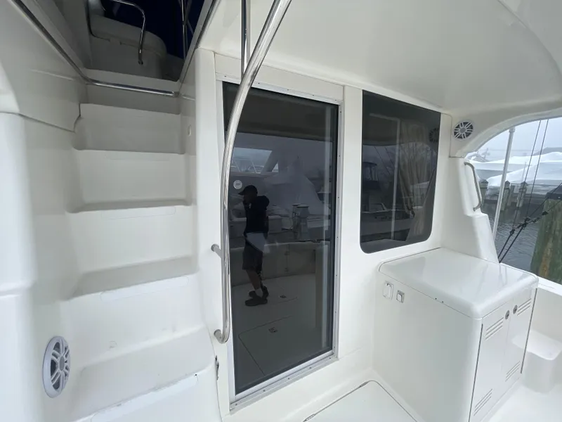 Slide: The Image of 2006 Silverton 42 Convertible yacht interior with stairs and sliding glass door. - 43