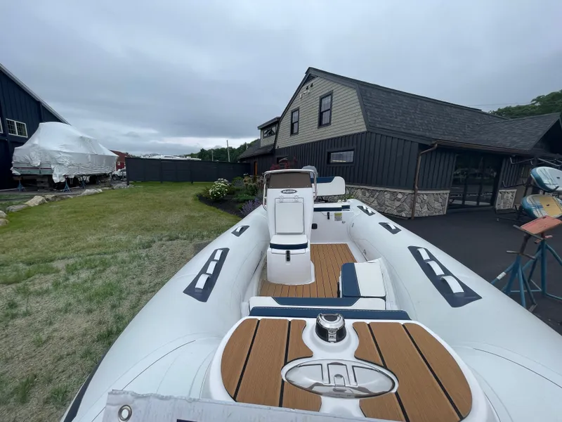 Slide: The Image of 2025 AB Inflatables Alumina 15 ALX boat in a yard, near a modern house. - 14
