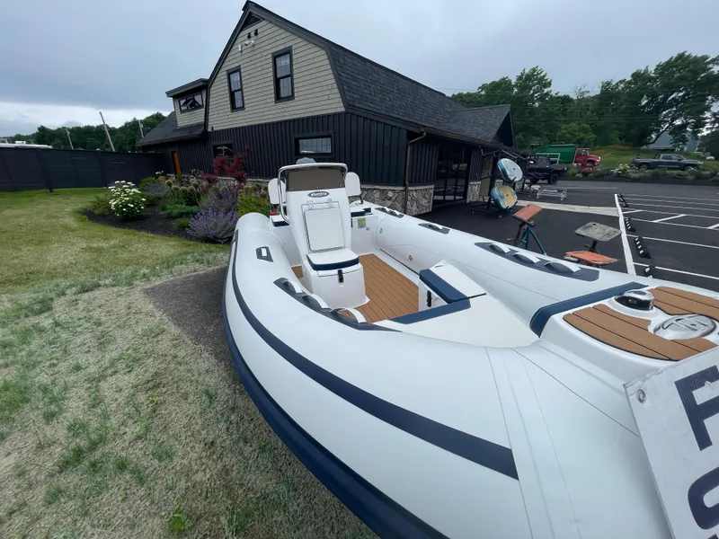 Slide: The Image of 2025 AB Inflatables Alumina 15 ALX boat displayed outdoors near a building. - 15