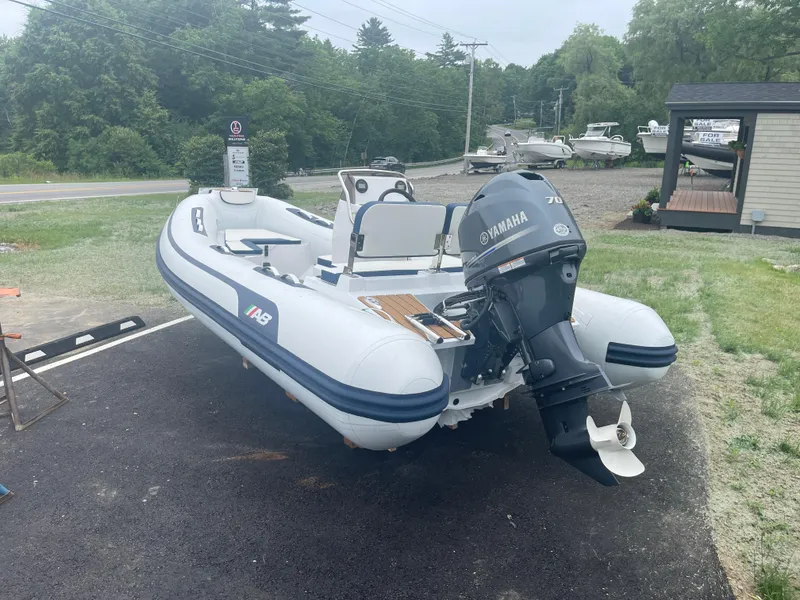 Slide: The Image of 2025 AB Inflatables Alumina 15 ALX boat with Yamaha motor on display outdoors. - 18
