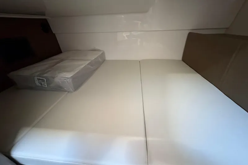 Slide: The Image of Interior cabin of 2026 Boston Whaler 325 Conquest with white seating. - 14