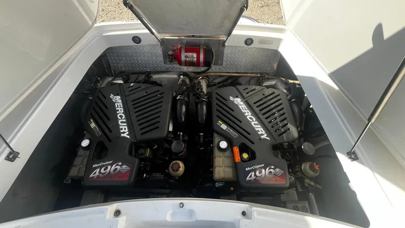 Slide: The Image of Twin Mercury engines in a 2005 Cobalt 343 boat engine compartment. - 13