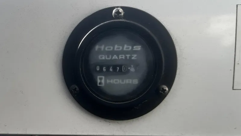 Slide: The Image of Hobbs Quartz hour meter showing 647 hours on a 2005 Cobalt 343. - 15