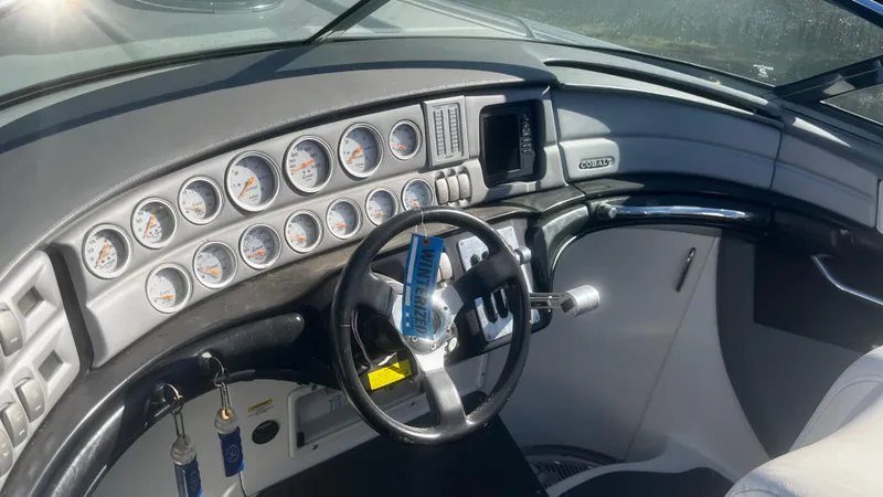 Slide: The Image of 2005 Cobalt 343 boat dashboard with gauges and steering wheel. - 8