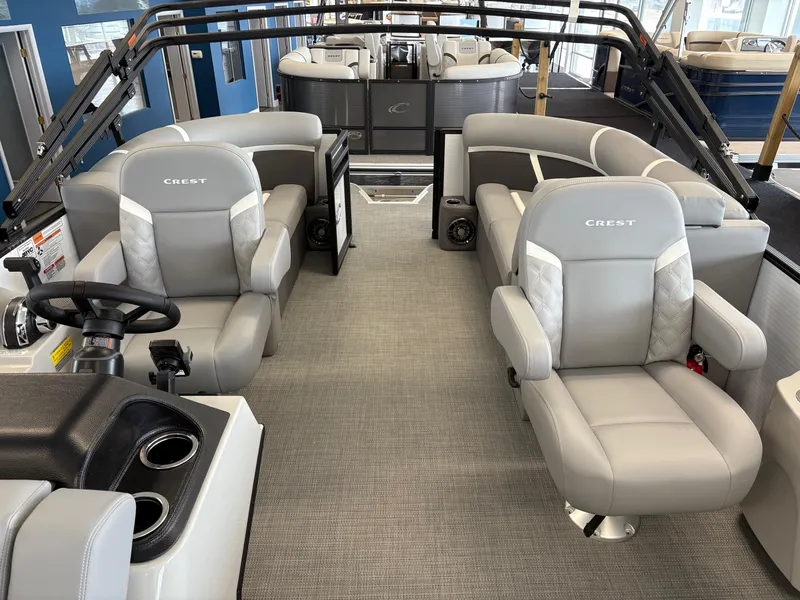 Slide: The Image of 2025 Crest 200 SLC Classic LX pontoon boat interior with luxurious seating and modern design. - 4