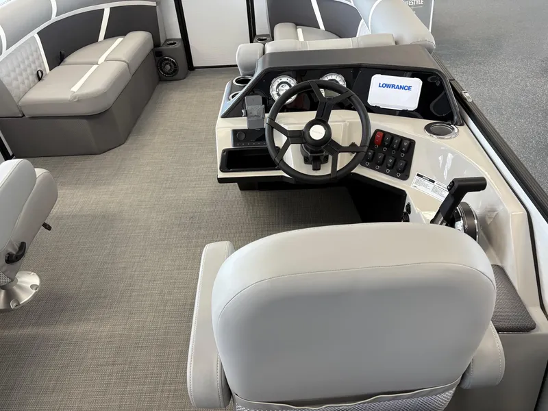 Slide: The Image of Interior of 2025 Crest 200 SLC Classic LX boat with modern steering and seating. - 5