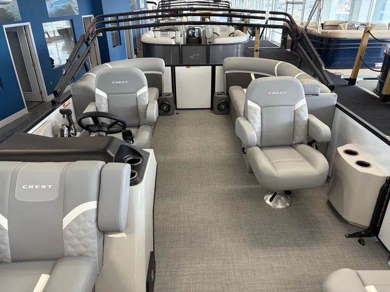 Slide: The Image of 2025 Crest 200 SLC Classic LX boat interior with gray seating and modern design. - 7
