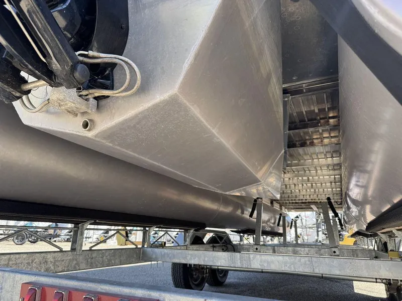 Slide: The Image of Underneath view of a 2006 Sun Tracker Party Cruiser 32 on a trailer. - 12