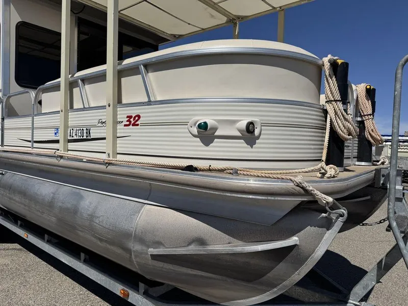 Slide: The Image of 2006 Sun Tracker Party Cruiser 32 pontoon boat on trailer, side view. - 16