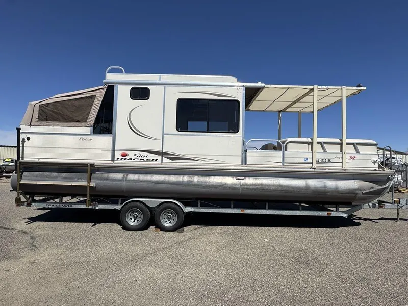 Slide: The Image of 2006 Sun Tracker Party Cruiser 32 pontoon boat on trailer, side view. - 19