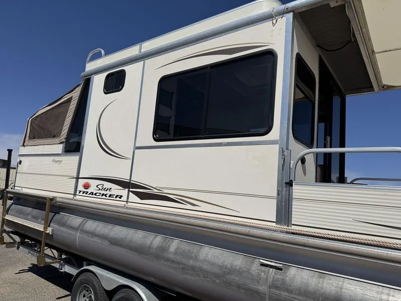 Slide: The Image of 2006 Sun Tracker Party Cruiser 32 pontoon boat with enclosed cabin and trailer. - 22