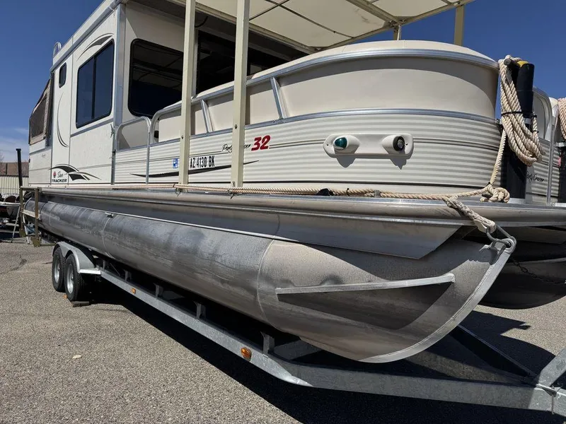 Slide: The Image of 2006 Sun Tracker Party Cruiser 32 pontoon boat on trailer, side view. - 25
