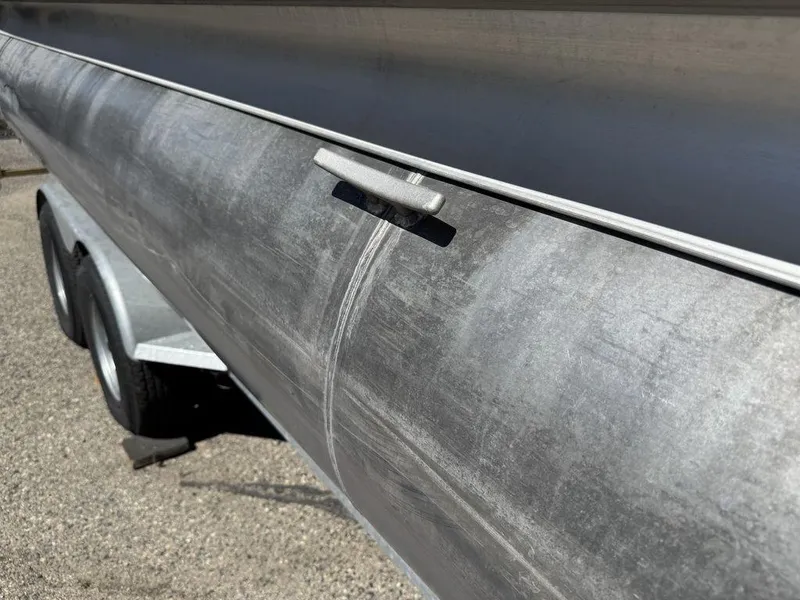 Slide: The Image of 2006 Sun Tracker Party Cruiser 32 pontoon boat on trailer, close-up view. - 27