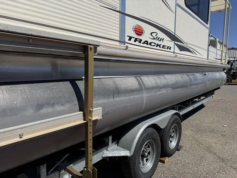 Slide: The Image of 2006 Sun Tracker Party Cruiser 32 pontoon boat on a trailer. - 28