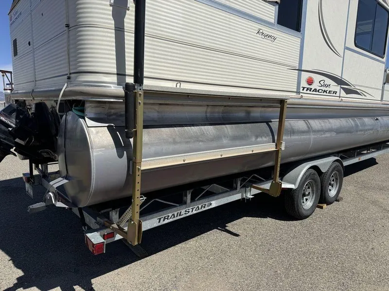 Slide: The Image of 2006 Sun Tracker Party Cruiser 32 on a Trailstar trailer, side view. - 3