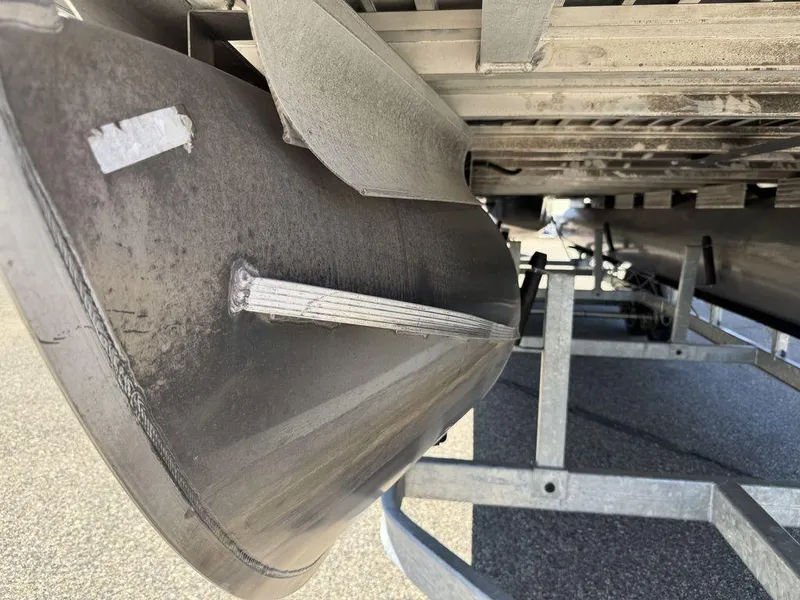 Slide: The Image of 2006 Sun Tracker Party Cruiser 32 pontoon boat underside on trailer. - 33