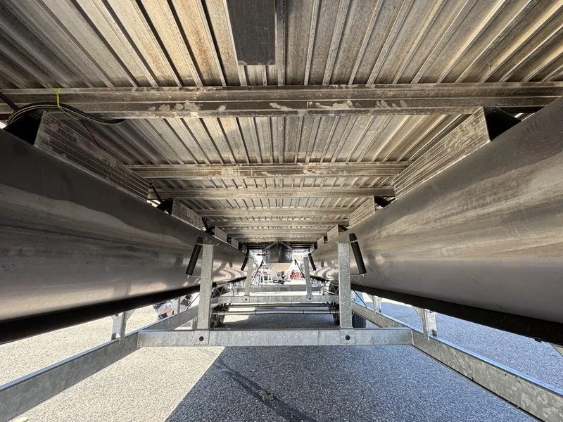 Slide: The Image of Underneath view of a 2006 Sun Tracker Party Cruiser 32 pontoon boat on a trailer. - 35