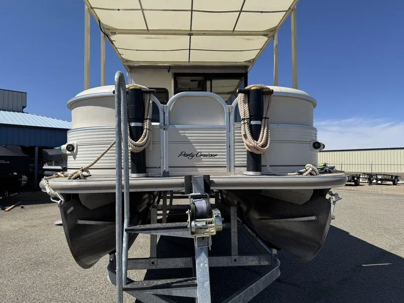 Slide: The Image of 2006 Sun Tracker Party Cruiser 32 pontoon boat on trailer, front view. - 38