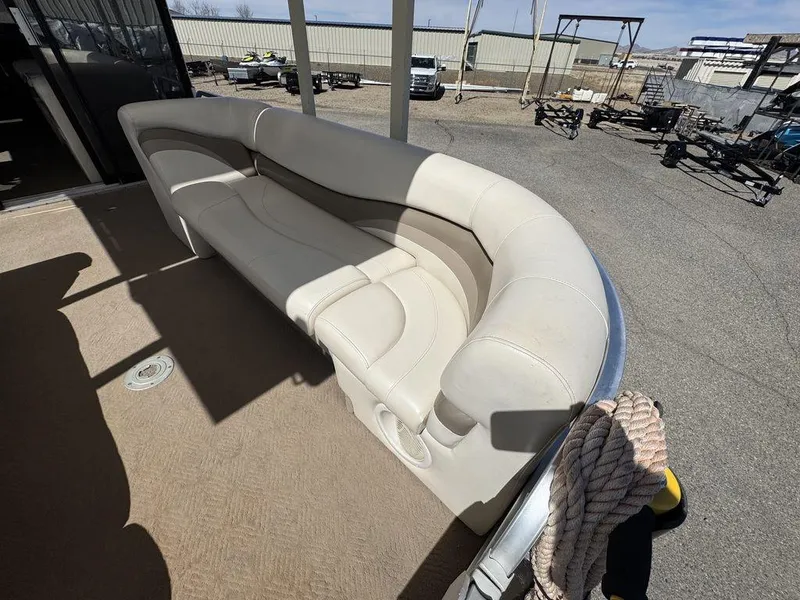 Slide: The Image of 2006 Sun Tracker Party Cruiser 32 with beige seating on deck. - 44