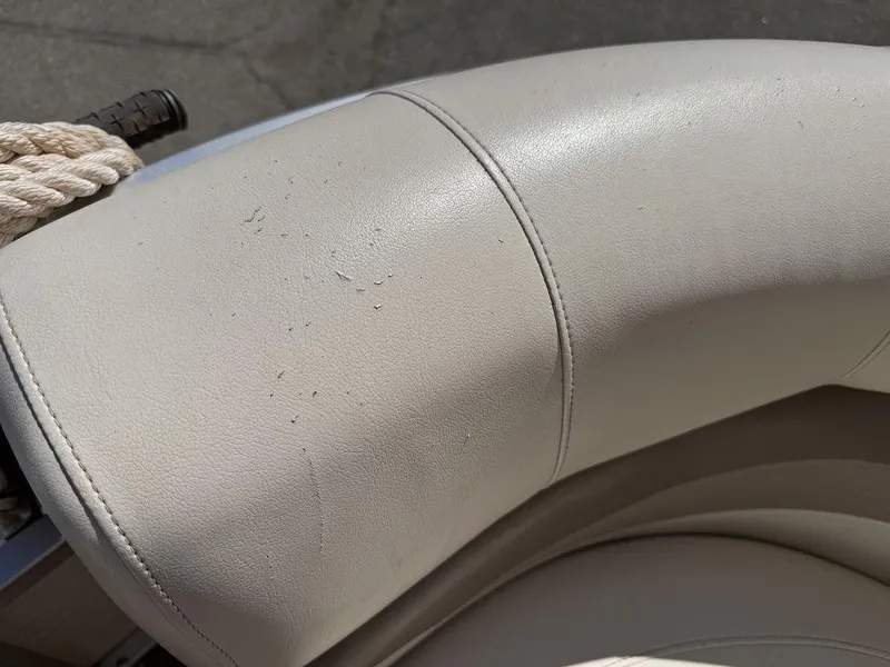 Slide: The Image of 2006 Sun Tracker Party Cruiser 32 boat seat with light wear and rope detail. - 46