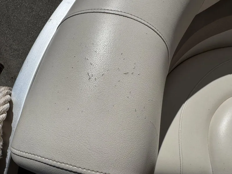 Slide: The Image of Worn upholstery on 2006 Sun Tracker Party Cruiser 32 boat seat. - 48