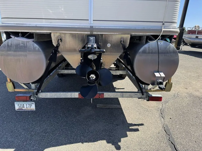 Slide: The Image of 2006 Sun Tracker Party Cruiser 32 rear view with dual pontoons and propeller. - 7